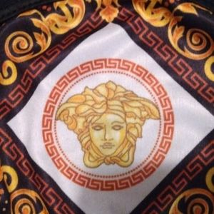 1 brand New packaged Versace Reversible mask